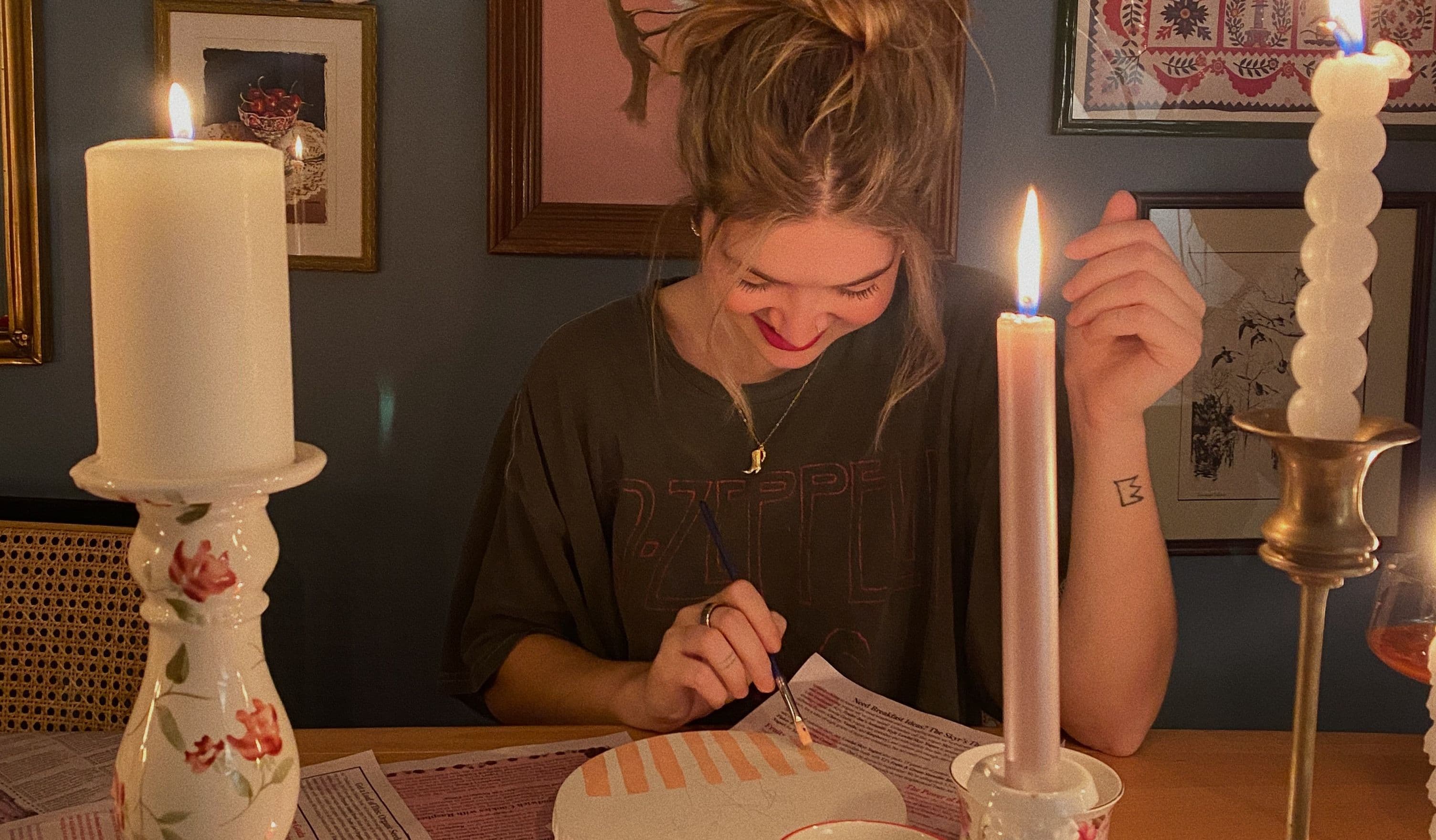 Smiling girl painting on plate