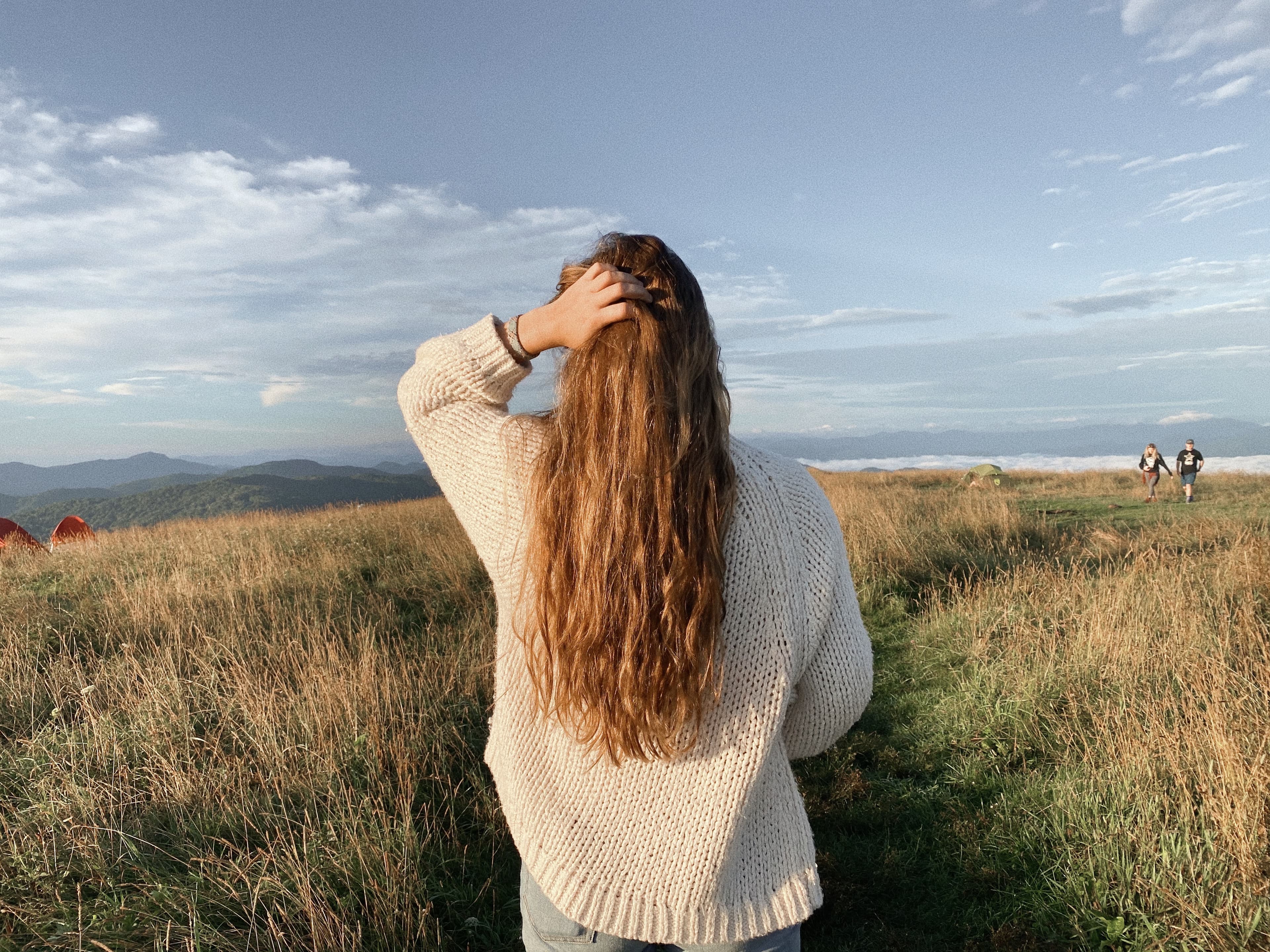 girl with hair in front of landscape