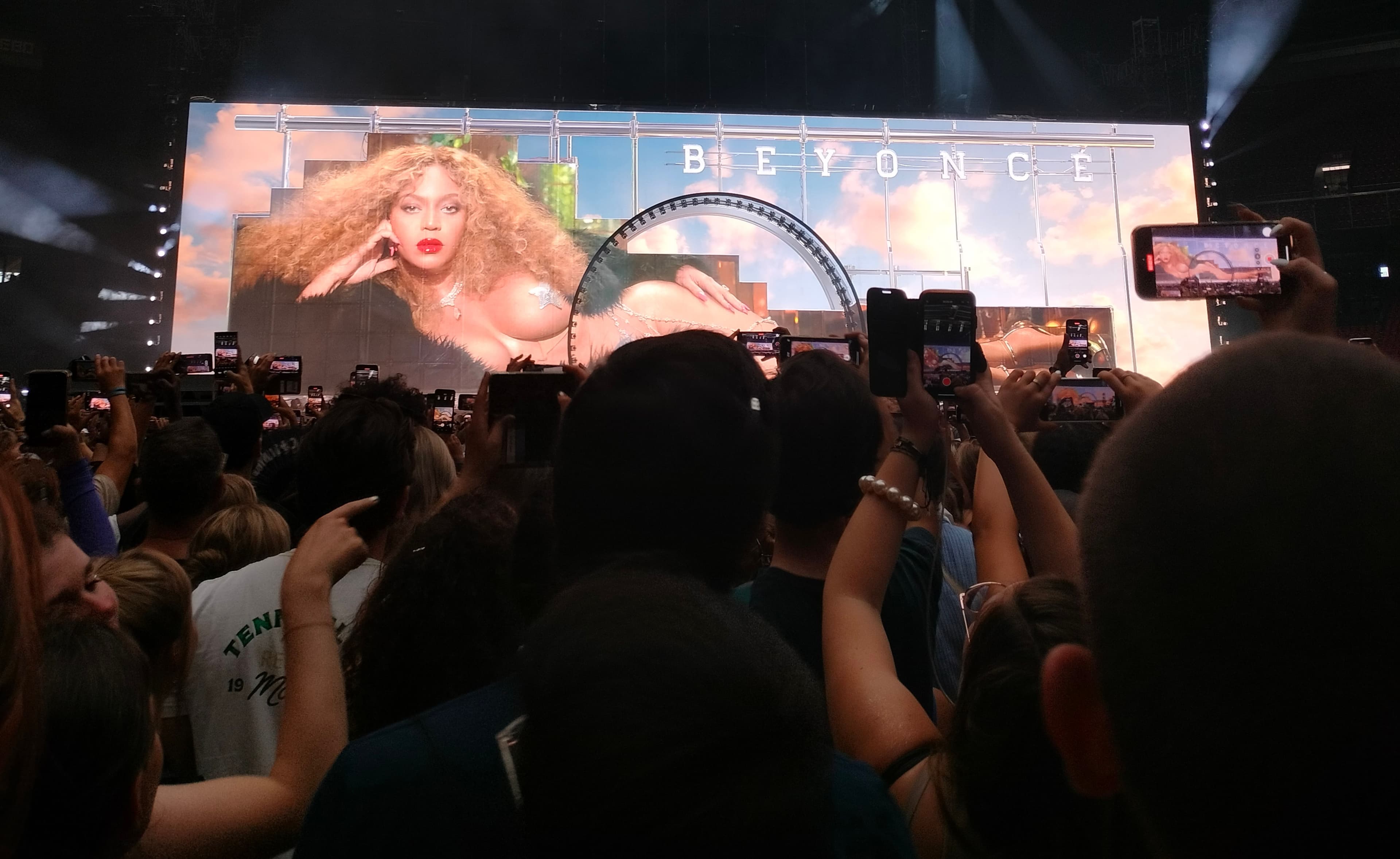 Beyoncé billboard with people taking pictures