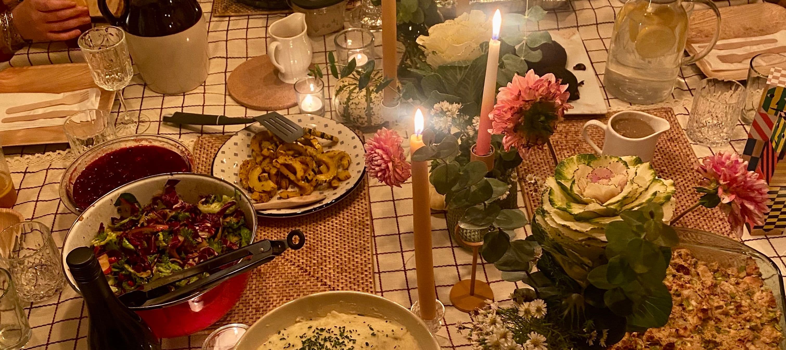 Candle lit dinner table with flowers