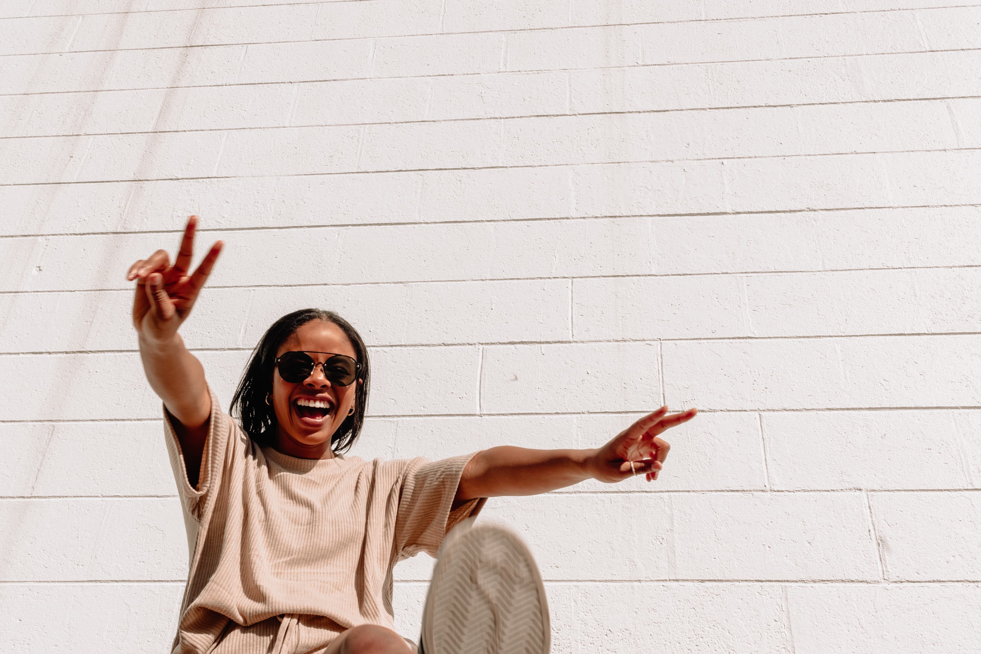 girl laughing against a white background