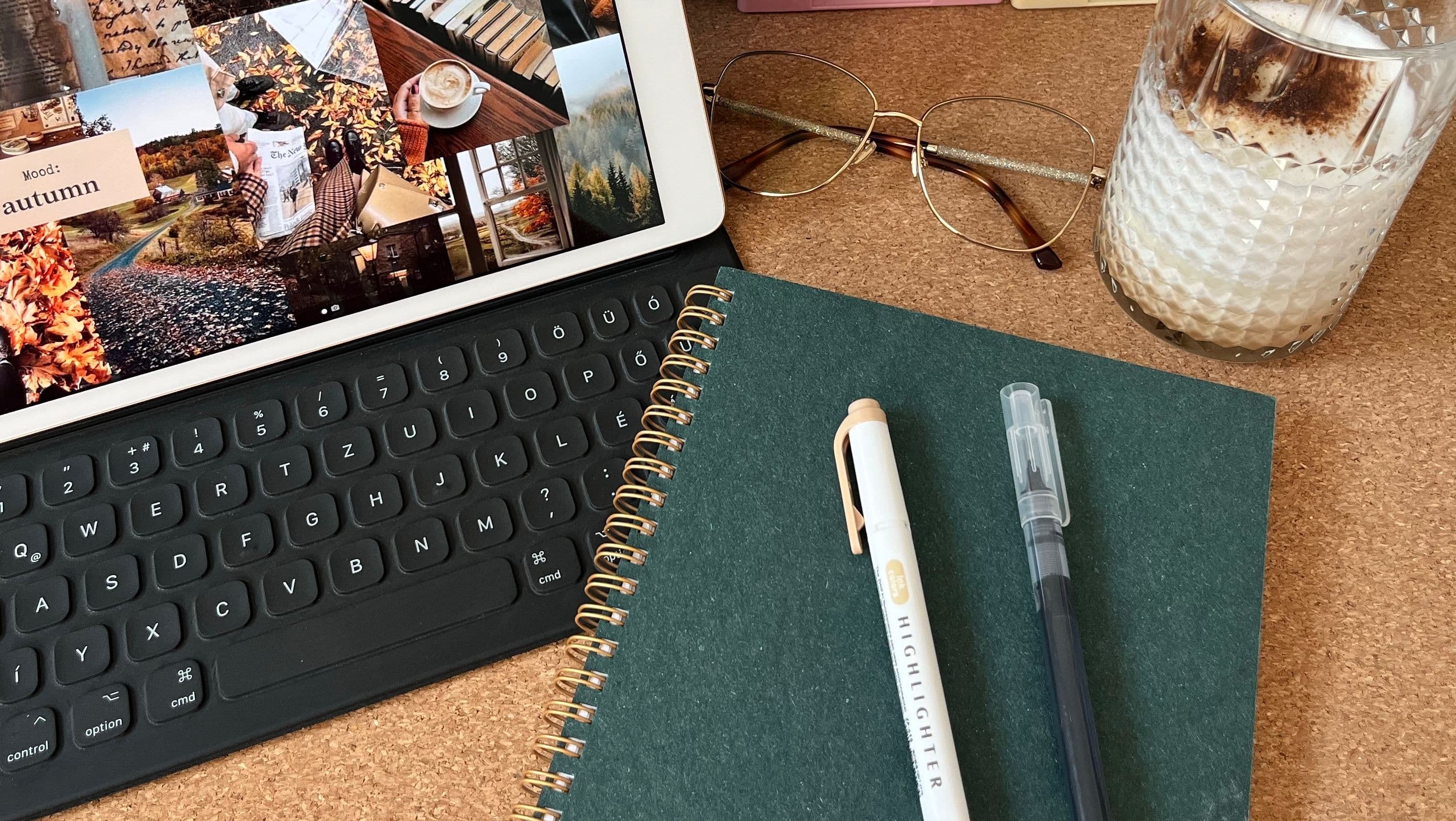 Ipad, notebook, pens, and glasses