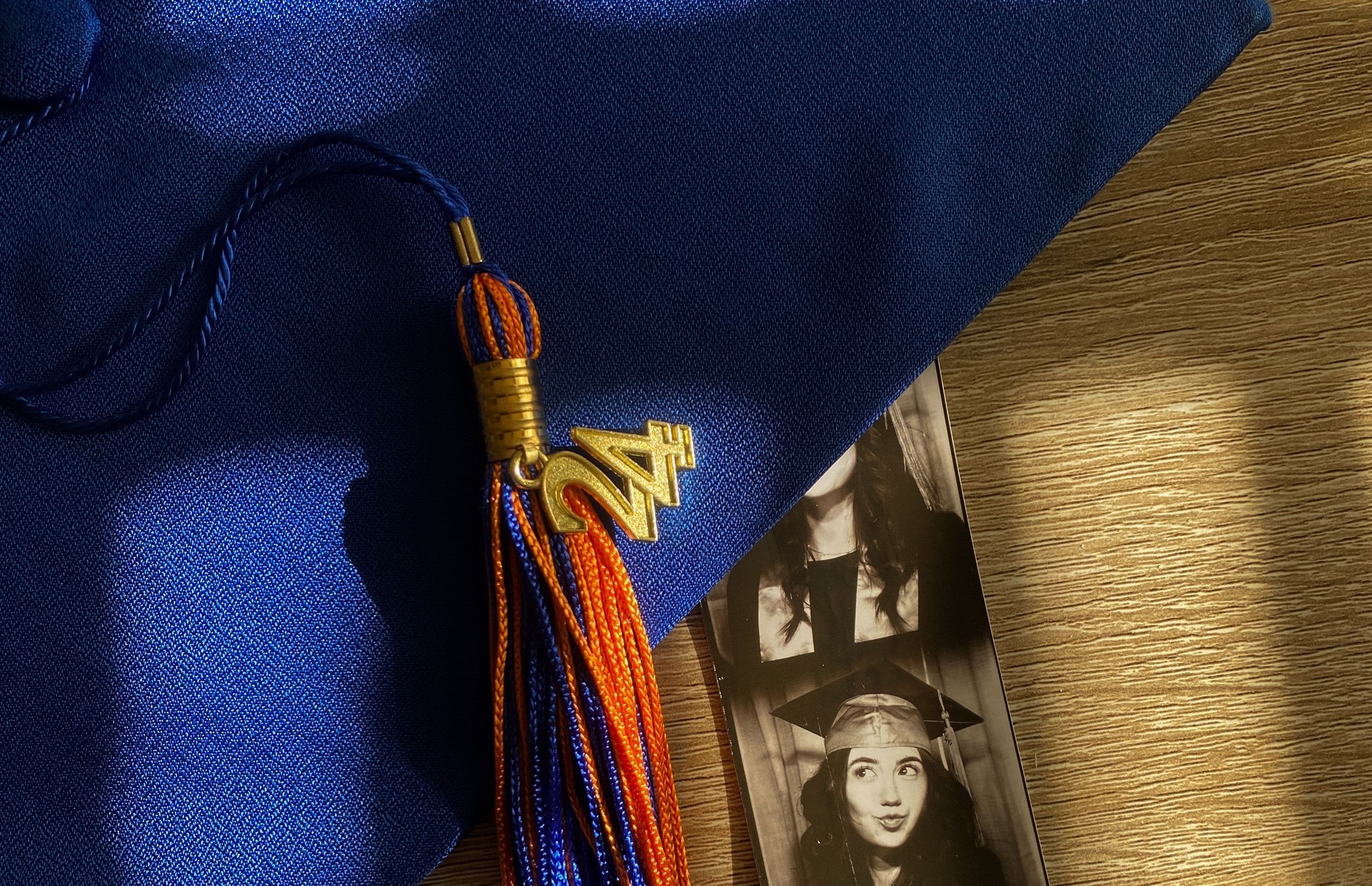 Graduation cap with photobooth strip of a graduate