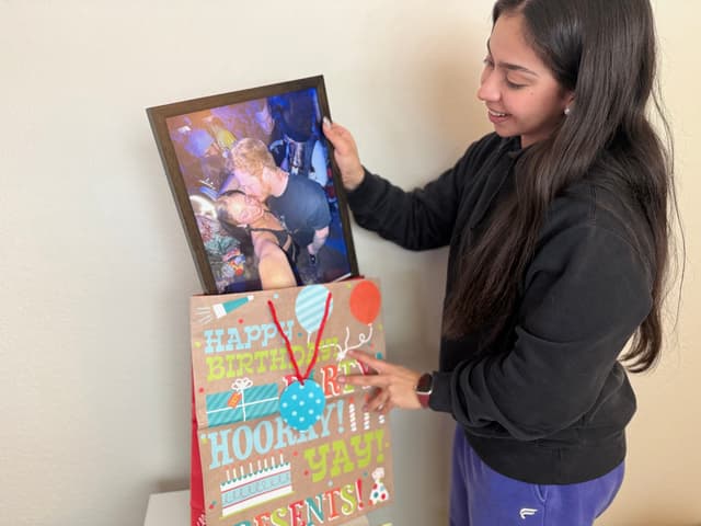 girl with a photo poster