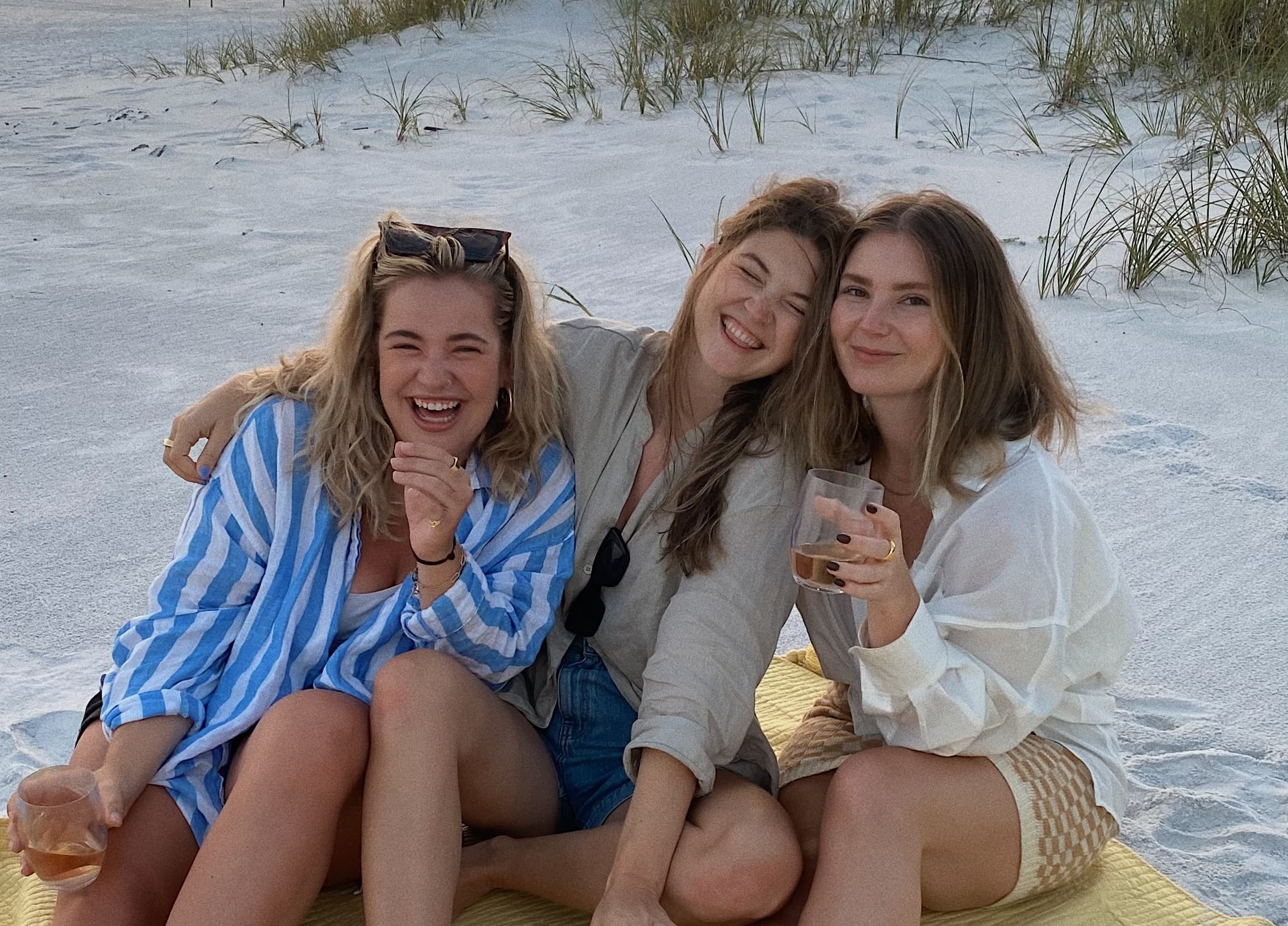 girlfriends smiling on the beach