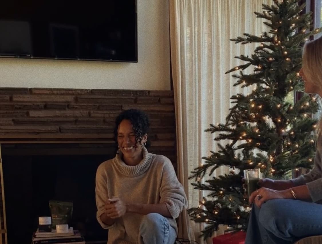woman in front of christmas tree