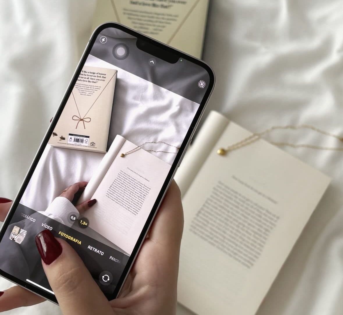 girl taking a photo of a book