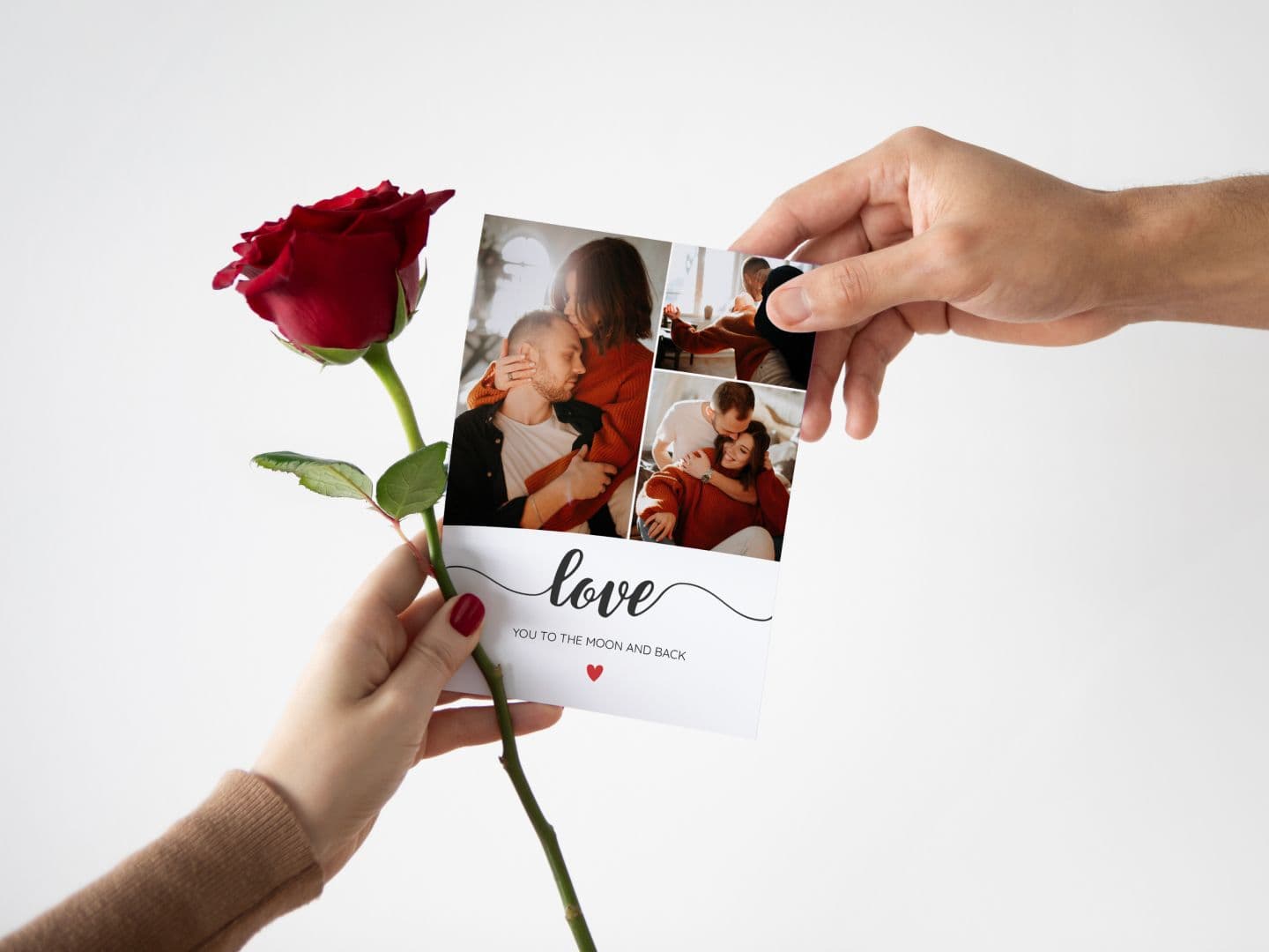 Two hands holding a Valentine's Day card and a red rose