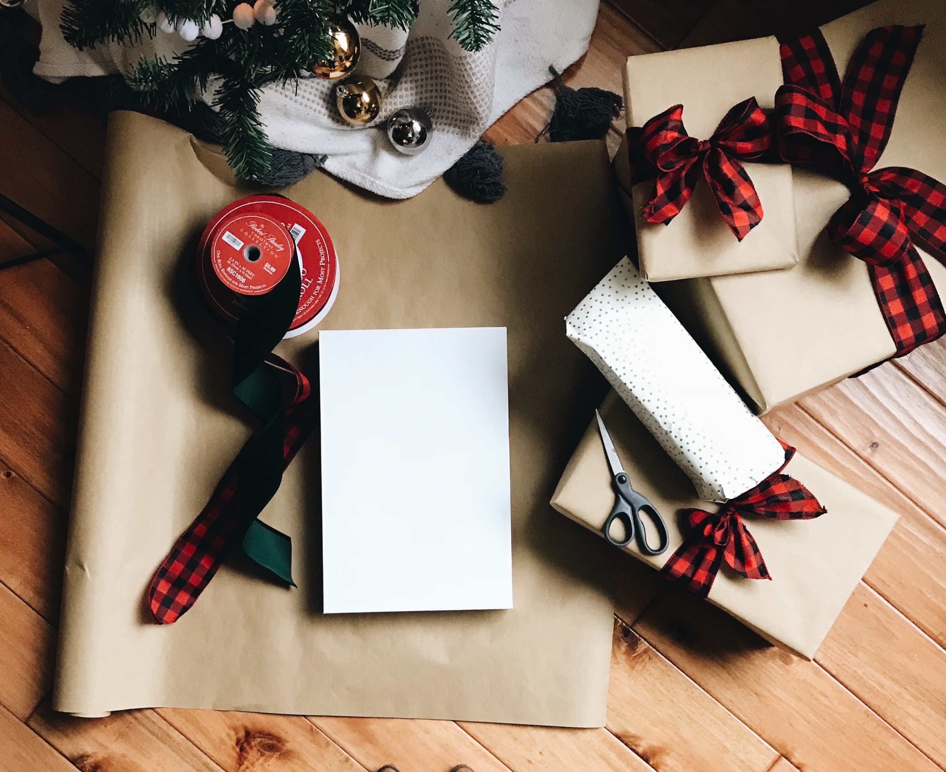 wrapping gifts un front of the tree